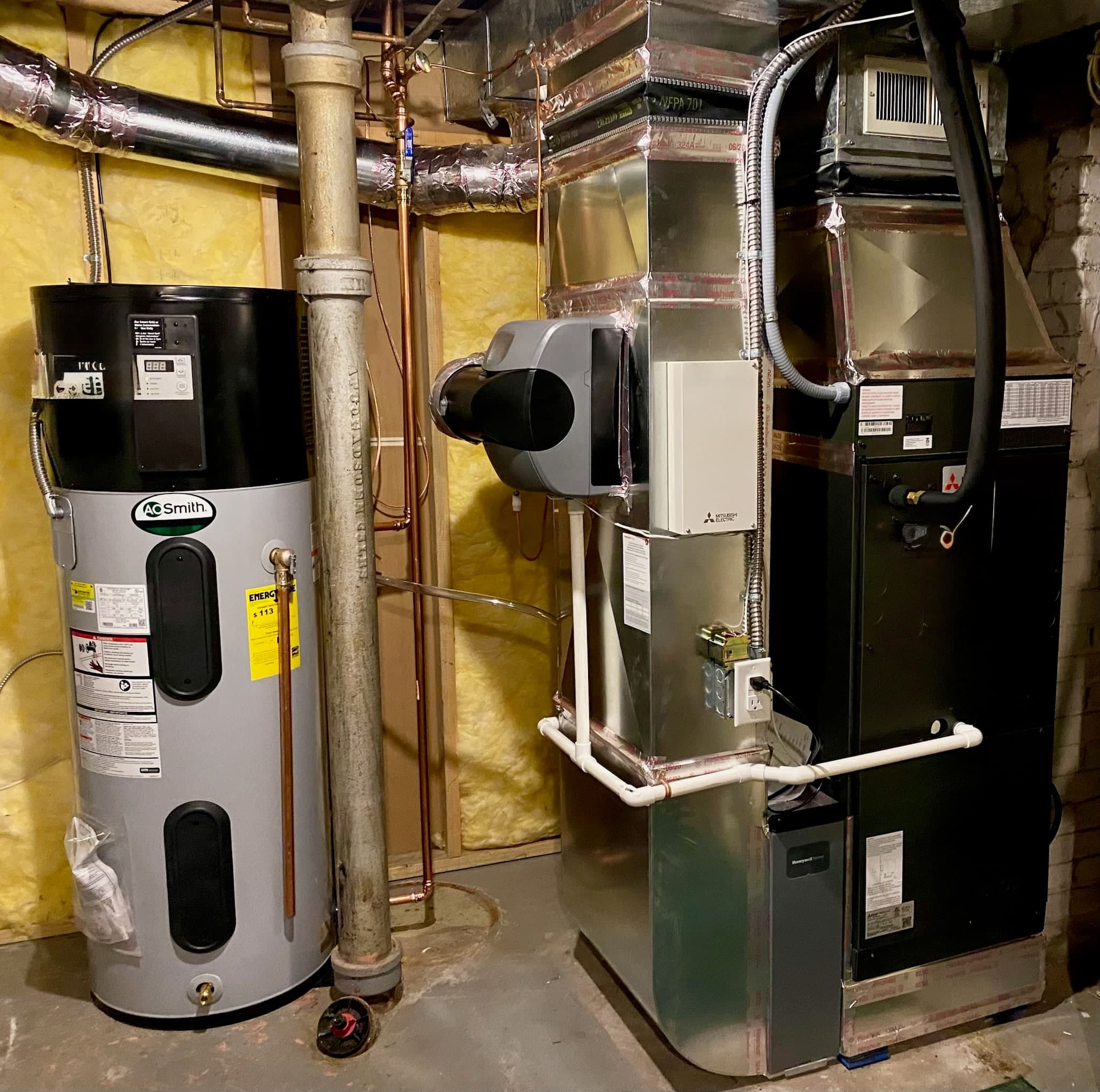 All-electric HVAC and heat pump water heater equipment in a finished mechanical room