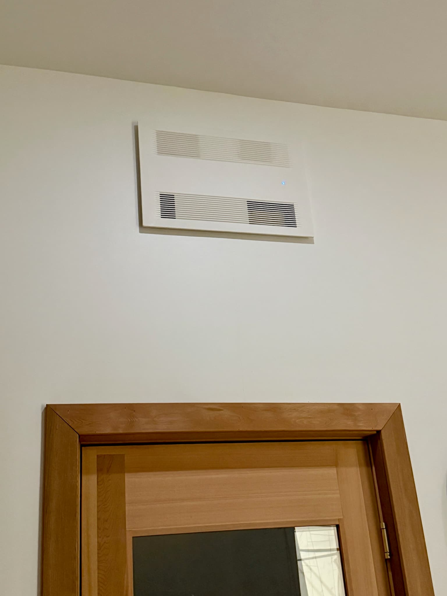 Compact room energy recovery ventilator installed in a Minnesota home